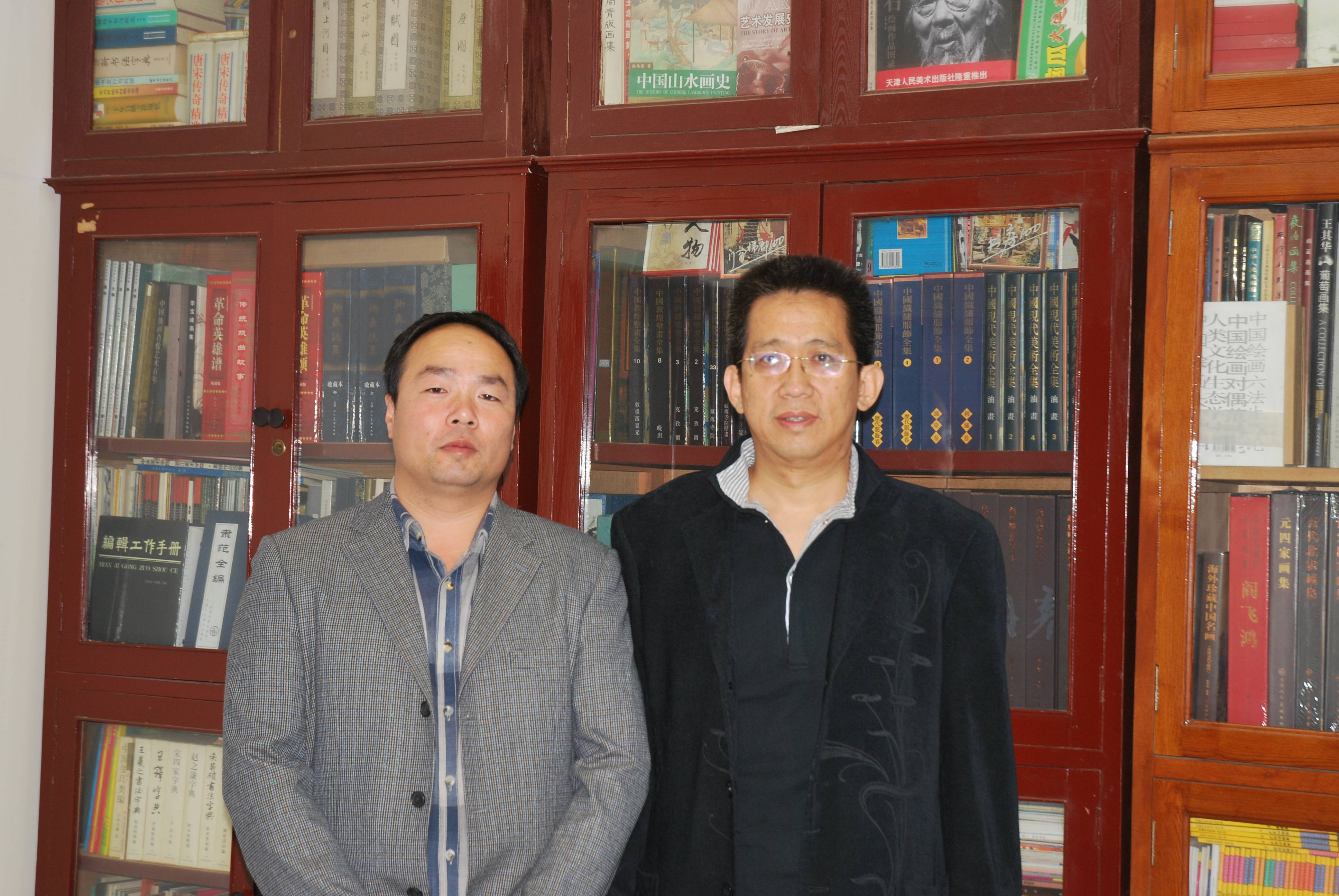 张占峰与天津人民美术出版社社长李毅峰